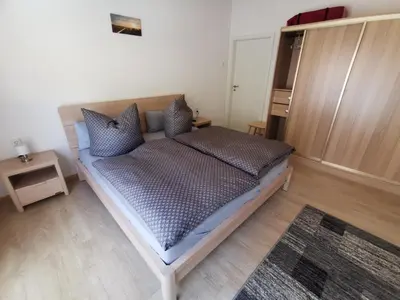 Ein Bett oder Betten in einem Zimmer der Unterkunft Ferienhäuser-Klapproth