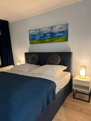 Ein Bett oder Betten in einem Zimmer der Unterkunft Apartment Bellevue Bad Harzburg