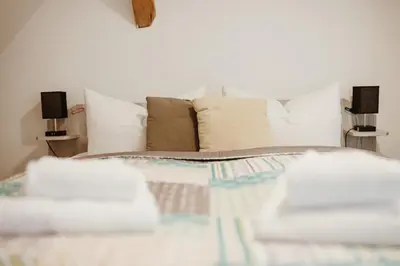 Ein Bett oder Betten in einem Zimmer der Unterkunft Waldrandzauber
