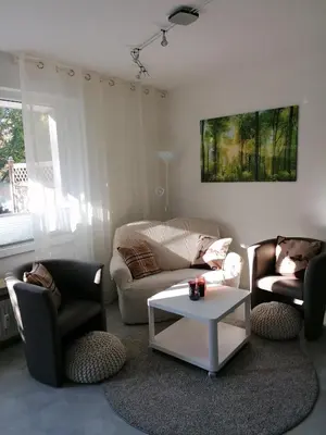 Ein Sitzbereich in der Unterkunft Ferienwohnung 'Auszeit Parkresidenz'