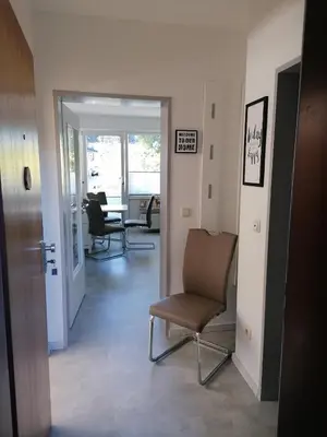 Ein Sitzbereich in der Unterkunft Ferienwohnung 'Auszeit Parkresidenz'