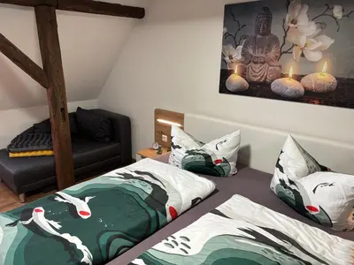 Ein Bett oder Betten in einem Zimmer der Unterkunft Am Graben 2