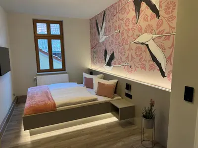 Ein Bett oder Betten in einem Zimmer der Unterkunft Stilapartment City 2