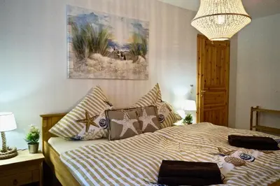 Ein Bett oder Betten in einem Zimmer der Unterkunft Herzstück
