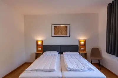 Ein Bett oder Betten in einem Zimmer der Unterkunft Ferienwohnung WurmbergQuartier mit Terrasse und Grill
