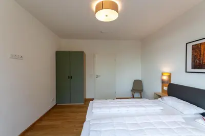 Ein Bett oder Betten in einem Zimmer der Unterkunft Ferienwohnung WurmbergQuartier mit Terrasse und Grill
