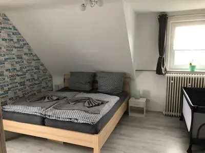 Ein Bett oder Betten in einem Zimmer der Unterkunft Ferienwohnung Wolfswiese
