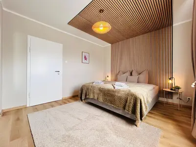 Ein Bett oder Betten in einem Zimmer der Unterkunft Harzburg-Living Wohnung Goethe`s Panorama