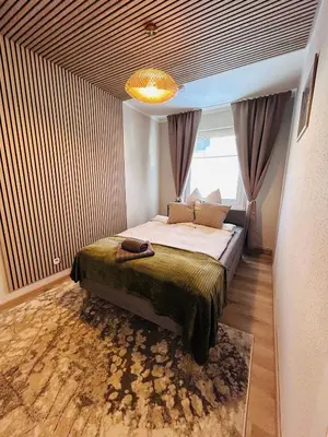 Ein Bett oder Betten in einem Zimmer der Unterkunft Harzburg-Living Wohnung Goethe`s Panorama