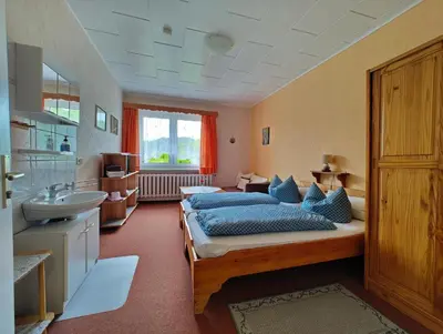 Ein Bett oder Betten in einem Zimmer der Unterkunft Pension Harzresidenz