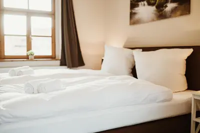 Ein Bett oder Betten in einem Zimmer der Unterkunft Gutshof zu Quedlinburg