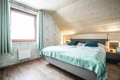 Ein Bett oder Betten in einem Zimmer der Unterkunft Waldstück