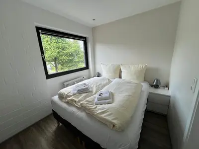 Ein Bett oder Betten in einem Zimmer der Unterkunft Schlummernest