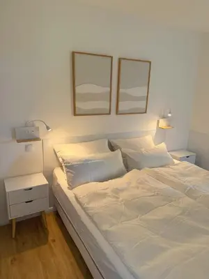 Ein Bett oder Betten in einem Zimmer der Unterkunft Apartment Wolfswarte, Panorama, Sauna, Schwimmbad