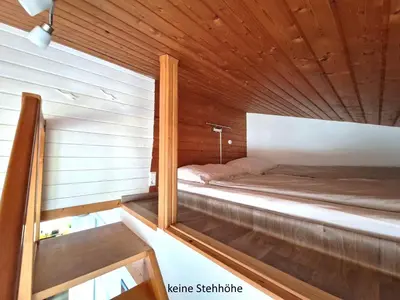 Ein Bett oder Betten in einem Zimmer der Unterkunft Ferienwohnung Tannenhöhe direkt am Wald