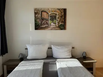 Ein Bett oder Betten in einem Zimmer der Unterkunft Ferienwohnungen Am Westerntor Amber Pepe und Paula inkl Parkplatz