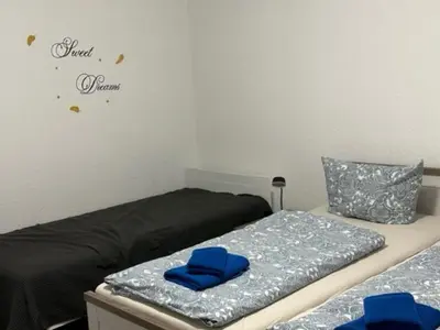 Ein Bett oder Betten in einem Zimmer der Unterkunft Ferienwohnungen Am Westerntor Amber Pepe und Paula inkl Parkplatz