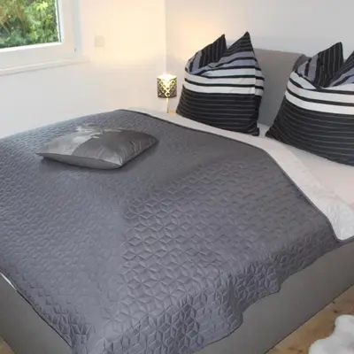 Ein Bett oder Betten in einem Zimmer der Unterkunft Wohnung Hahnenklee