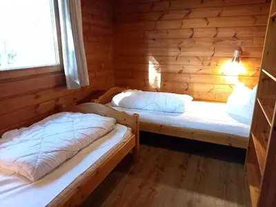Ein Bett oder Betten in einem Zimmer der Unterkunft Hasselhäuser Hasselhaus 4