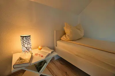 Ein Bett oder Betten in einem Zimmer der Unterkunft Auerhahn Ferienhäuser Auerhahn 403