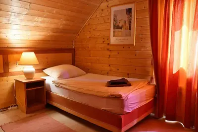 Ein Bett oder Betten in einem Zimmer der Unterkunft Auerhahn Ferienhäuser Auerhahn 404