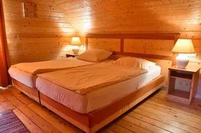 Ein Bett oder Betten in einem Zimmer der Unterkunft Auerhahn Ferienhäuser Auerhahn 509
