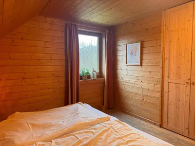 Ein Bett oder Betten in einem Zimmer der Unterkunft Auerhahn Ferienhäuser Auerhahn 510