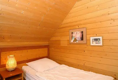 Ein Bett oder Betten in einem Zimmer der Unterkunft Auerhahn Ferienhäuser Auerhahn 510