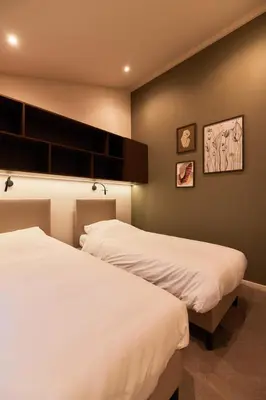 Ein Bett oder Betten in einem Zimmer der Unterkunft Harz Eco Lodges