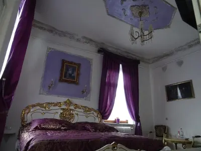 Ein Bett oder Betten in einem Zimmer der Unterkunft Villa Imperia, Museums-Hotel, Treppensteigen