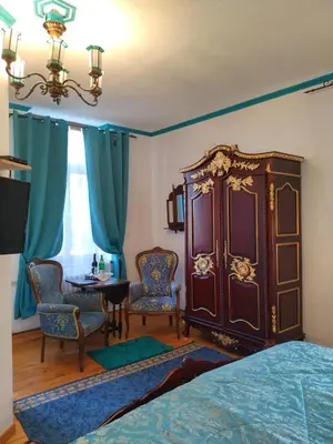 Ein Bett oder Betten in einem Zimmer der Unterkunft Villa Imperia, Museums-Hotel, Treppensteigen