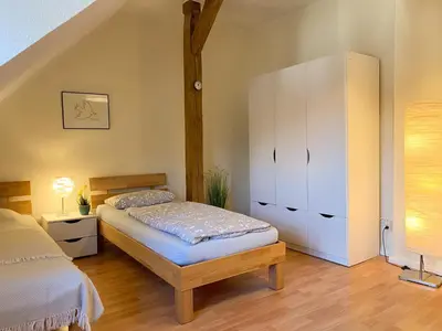 Ein Bett oder Betten in einem Zimmer der Unterkunft Gröpernblick - Zentrumsnahe FeWo I 2 Schlafzimmer I 100 qm I Parkplätze in der Umgebung
