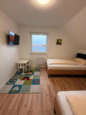 Ein Bett oder Betten in einem Zimmer der Unterkunft Auerhahn Ferienhäuser Haus Tajo