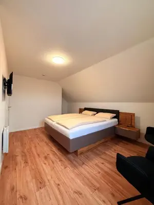Ein Bett oder Betten in einem Zimmer der Unterkunft Auerhahn Ferienhäuser Haus Tajo
