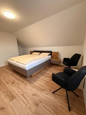 Ein Bett oder Betten in einem Zimmer der Unterkunft Auerhahn Ferienhäuser Haus Tajo