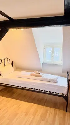 Ein Bett oder Betten in einem Zimmer der Unterkunft Bleibe am Kirchhof