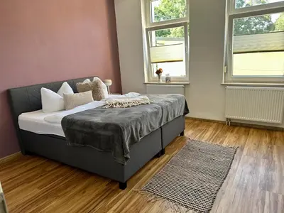 Ein Bett oder Betten in einem Zimmer der Unterkunft Parkblick