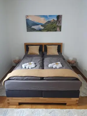 Ein Bett oder Betten in einem Zimmer der Unterkunft Apartments am Berg