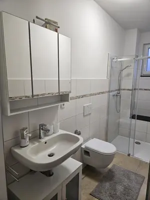 Ein Badezimmer in der Unterkunft Apartments am Berg