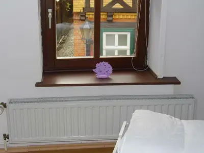 Ein Bett oder Betten in einem Zimmer der Unterkunft FerienwohnungQuedlinburg