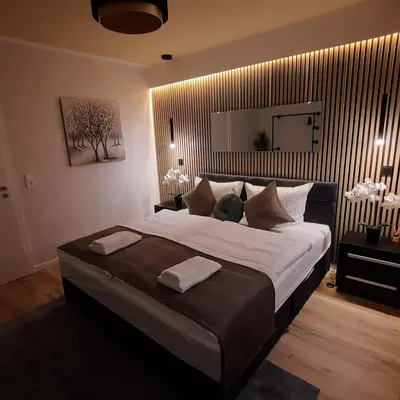 Ein Bett oder Betten in einem Zimmer der Unterkunft Bergliebe 5 mit großer Terrasse, Tiefgarage & Lift