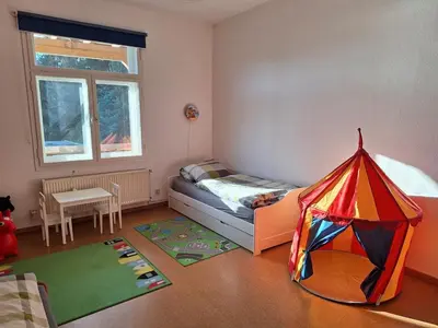 Ein Bett oder Betten in einem Zimmer der Unterkunft Familienfreundliche Ferienwohnung