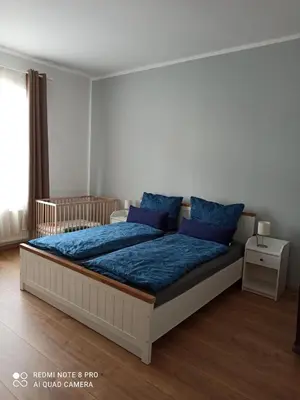 Ein Bett oder Betten in einem Zimmer der Unterkunft Familienfreundliche Ferienwohnung