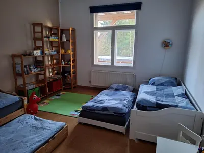 Ein Bett oder Betten in einem Zimmer der Unterkunft Familienfreundliche Ferienwohnung