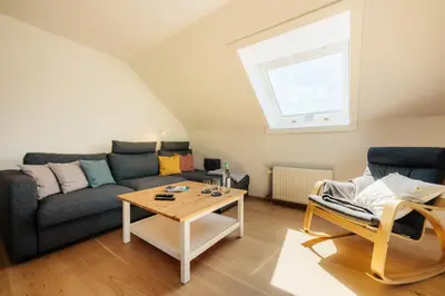 Ein Sitzbereich in der Unterkunft Heavenly Harz