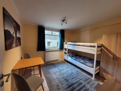 Ein Bett oder Betten in einem Zimmer der Unterkunft Kreuztaloase