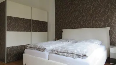 Ein Bett oder Betten in einem Zimmer der Unterkunft Ferienwohnung Heinrich