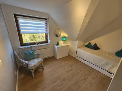 Ein Bett oder Betten in einem Zimmer der Unterkunft Ferienwohnung Starke