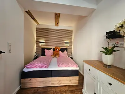 Ein Bett oder Betten in einem Zimmer der Unterkunft Altstadtsuite Wernigerode