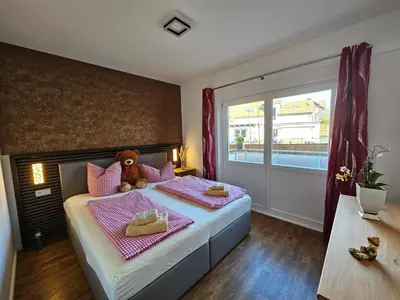 Ein Bett oder Betten in einem Zimmer der Unterkunft Altstadtsuite Wernigerode